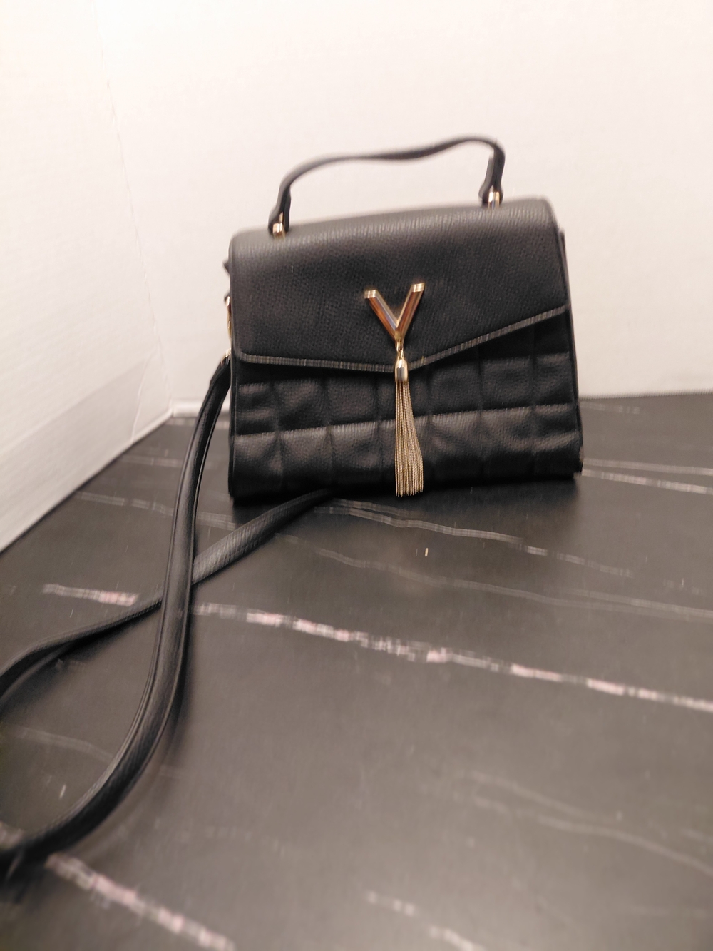 Crossi Black Quilted Satchel with Gold Tassel Accent